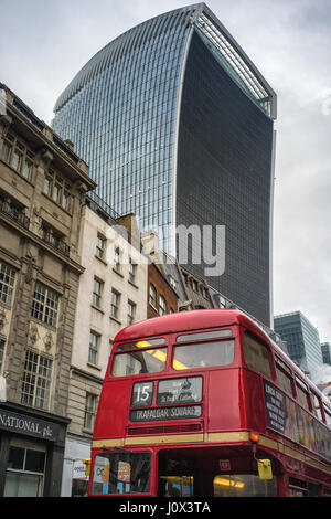 Two London icons, the original red Routemaster bus and the new landmark building of 20 Fenchurch Street known as the walkie talkie building Stock Photo