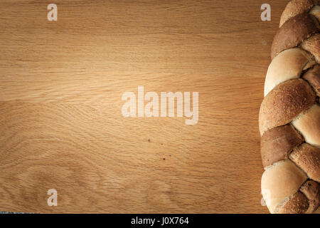 3 kinds interwoven bread lying on a wooden table with copy space. food concept Stock Photo