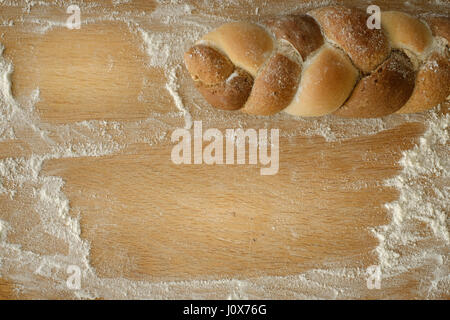 3 kinds interwoven bread lying on a wooden table with copy space. food concept Stock Photo