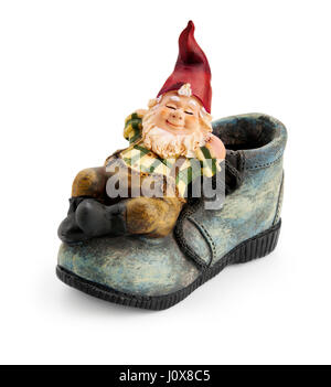 Gnome sitting on a boot isolated with clipping path  Stock Photo