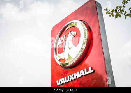 Vauxhall car logo and cars on a garage forecourt in London Stock Photo