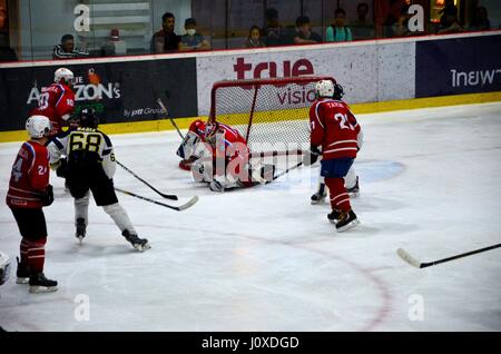 Mongolia team players and goalie defend goal shot vs Malaysia in Ice Hockey match in rink Bangkok Thailand Stock Photo