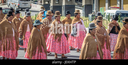 Traditional Women (Cholitas) in Typical Clothes during 1st of May Labor Day Parade - La Paz, Bolivia Stock Photo