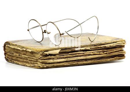 antique book with glasses isolated on white background Stock Photo