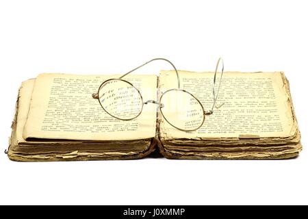 antique book with glasses isolated on white background Stock Photo