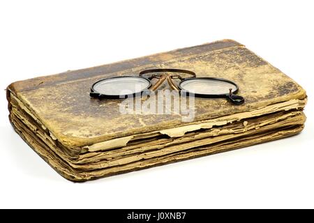 antique book with pince-nez isolated on white background Stock Photo