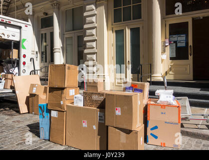 FedEx packages sitting on a cobblestones SoHo street in New York City Stock Photo