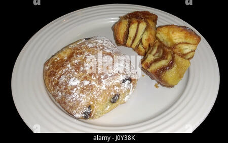 Croissant and Cinnamon bites on a white plate isolated Stock Photo