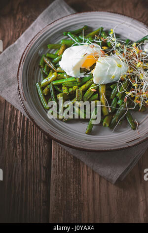 Salad with green beans, flax and quail eggs vertical Stock Photo