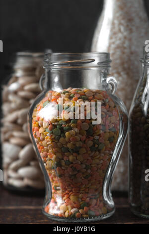 Lentils, rice in glass jars healthy food vertical Stock Photo