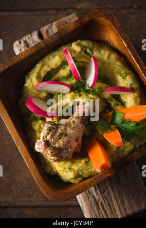 Salad of beans, chicken, carrots, radishes in a bowl top view vertical Stock Photo