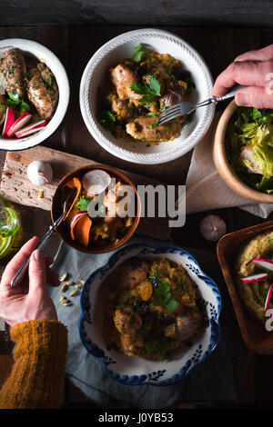 Pilaf, Salad in bowls on the holiday table vertical Stock Photo