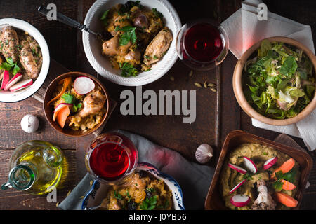 Pilaf, Salad and drink on festive table horizontal Stock Photo