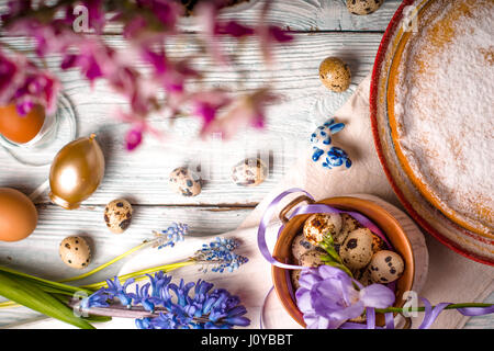 Easter decoration  , flowers and German Easter cake on the white wooden table Stock Photo