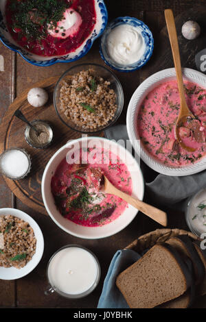 Dinner with traditional Russian dishes on the wooden table vertical Stock Photo