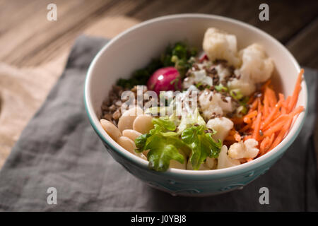 Healthy salad with buckwheat and vegetables on the blurred background Stock Photo