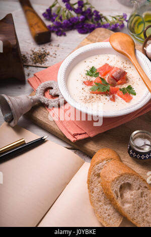 Soup puree from cauliflower and salmon side view Stock Photo
