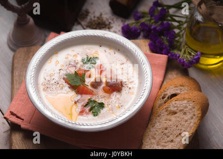 Soup puree with salmon in a ceramic bowl closeup Stock Photo