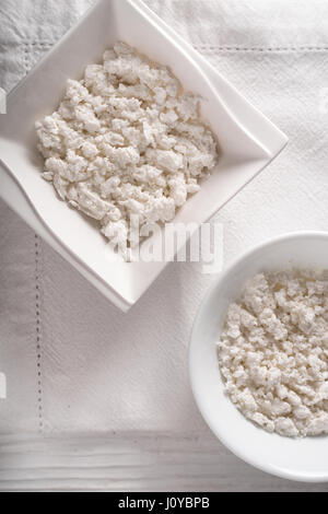 Cottage cheese in ceramic bowls on a napkin diagonal Stock Photo