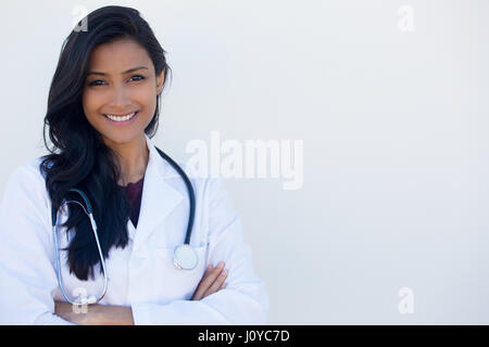 Closeup portrait of friendly, smiling confident female doctor hands arms crossed folded, healthcare professional isolated white background. Stock Photo