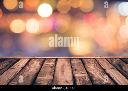 Empty wood table top with blurred lights gold bokeh abstract background Stock Photo
