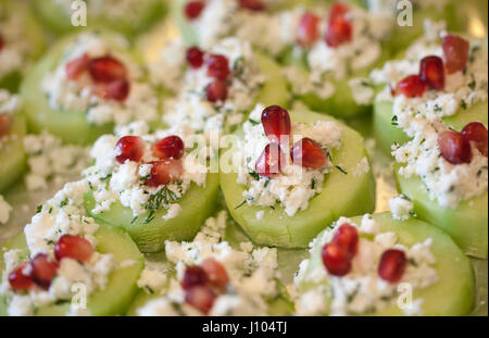 Cucumber Pomegranate and feta canapés with Dill Stock Photo