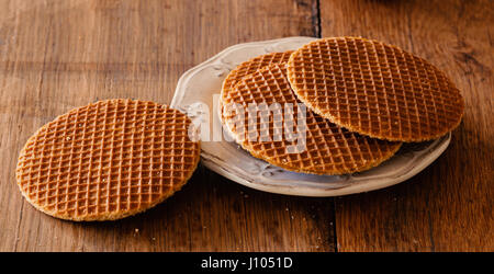 Typical sweet waffles with sugar syrup from Holland. Stock Photo