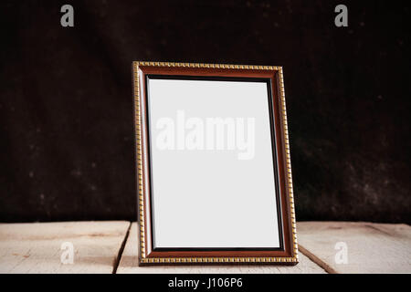 Picture frames on the old wooden. Stock Photo