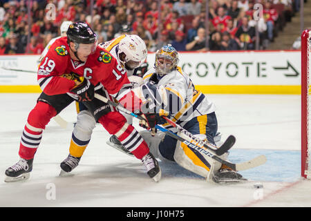 Chicago, Illinois, USA. 15th Apr, 2017. - Blackhawk #19 Jonathan Toews attempts a shot on Predator Goaltender #35 Pekka Rinne during the National Hockey League First Round Playoff game between the Chicago Blackhawks and the Nashville Predators at the United Center in Chicago, IL. Credit: csm/Alamy Live News Stock Photo