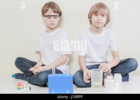 Little scientists preparing to make science experiments. Education concept. Stock Photo