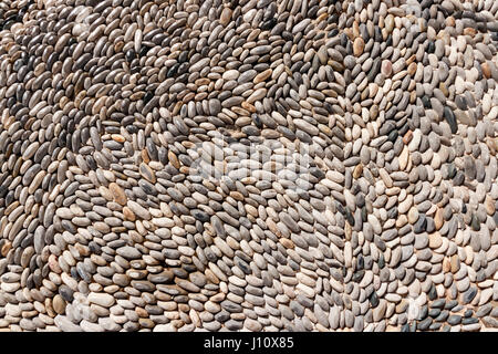 Background of lined small gray stones Stock Photo