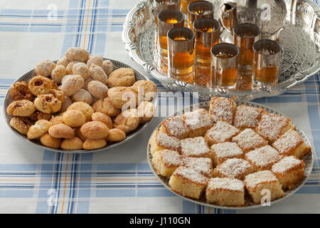 Traditional variety of festive Moroccan cookies and mint tea Stock Photo