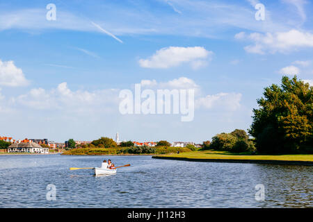 People boating on Fairhaven lake in Lytham St Annes. Stock Photo