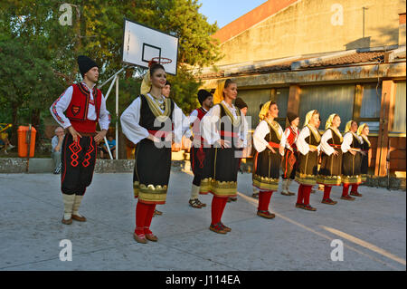 Ivanovo, Serbia, August 15, 2016. The group of young people dancing traditional folk dances from the region of Serbia. Stock Photo