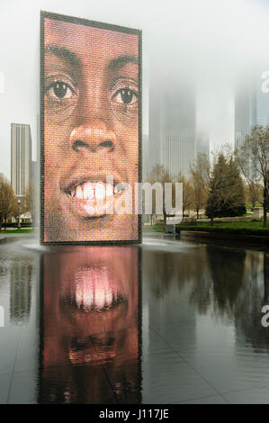 Chicago landmarks, city park, Crown Fountain human face reflecting on the pool, overcast skies, Millenium Park, in Chicago, Illinois, USA. Stock Photo