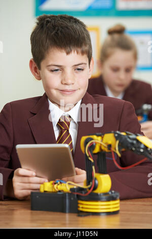 Pupils In Science Lesson Studying Robotics Stock Photo