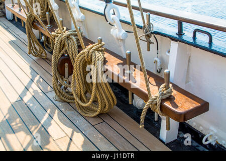 View of Ship Deck Tied Up Ropes and Sea Stock Photo