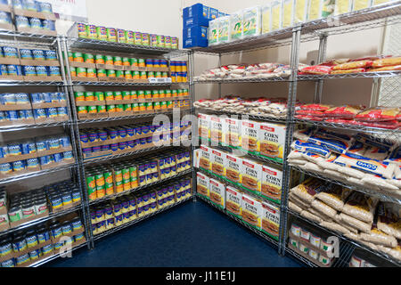 Catholic Charities Bronx Food Distribution Center in New York on Holy Thursday, April 13, 2017. The distribution center, stocked with generous donations from Goya Foods and other companies processes 513,000 lbs. of food per month, distributing directly to the needy and through a network of interfaith food pantries throughout the Bronx and Upper Manhattan. Catholic Charities is celebrating its 100 year anniversary this year. (© Richard B. Levine) Stock Photo