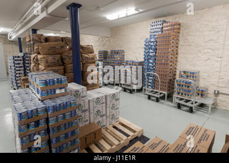 Catholic Charities Bronx Food Distribution Center in New York on Holy Thursday, April 13, 2017. The distribution center, stocked with generous donations from Goya Foods and other companies processes 513,000 lbs. of food per month, distributing directly to the needy and through a network of interfaith food pantries throughout the Bronx and Upper Manhattan. Catholic Charities is celebrating its 100 year anniversary this year. (© Richard B. Levine) Stock Photo