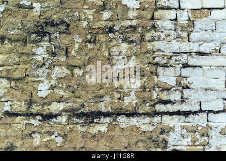 Old weathered mudbrick wall texture, mud-brick construction is often adobe Stock Photo