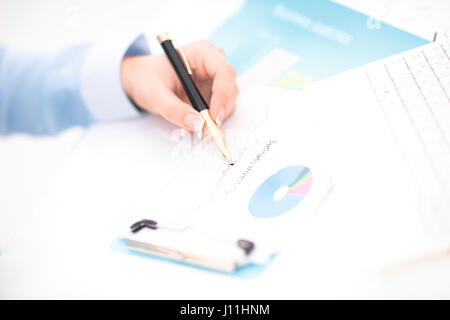 Woman hand signing a contract Stock Photo