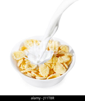 corn flakes with milk splash isolated on white background. Milk pouring into a white bowl of cornflakes. Healthy breakfast Stock Photo