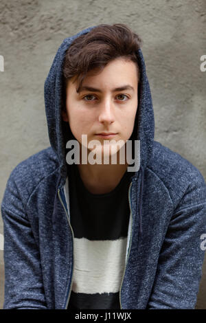 Serious teenager guy with hood on the head Stock Photo