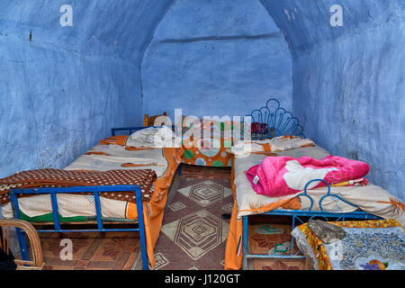 blue painted sleeping room with beds inside house in nubian village near Aswan, Egypt, Africa Stock Photo