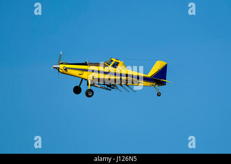 A small crop duster is flying in the sky near Spangle, Washington. Stock Photo