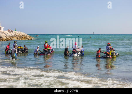 Jet skis waiting at start of race on beach at Spanish Championship april 2017, Jet ski, jetski, Benalmadena, Andalusia, Spain. Stock Photo