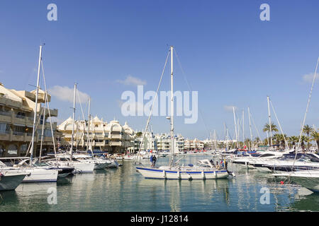 Sailboat entering port of Benalmadena, Andalusia, Spain. Stock Photo