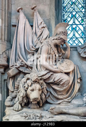 Guildhall, London, UK (the Great Hall). Detail of the monument to Lord Nelson featuring a mourning figure of Britannia seated on the British lion Stock Photo