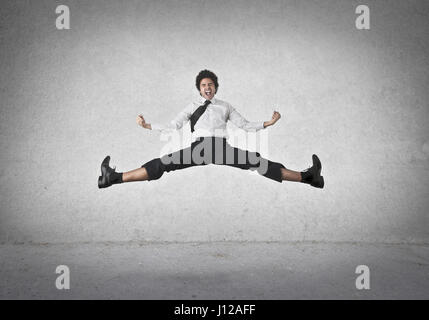 Man jumping and doing a split Stock Photo