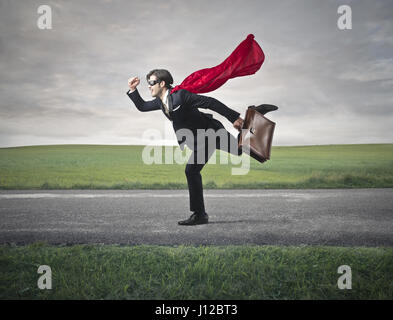 Businessman with cape and briefcase Stock Photo